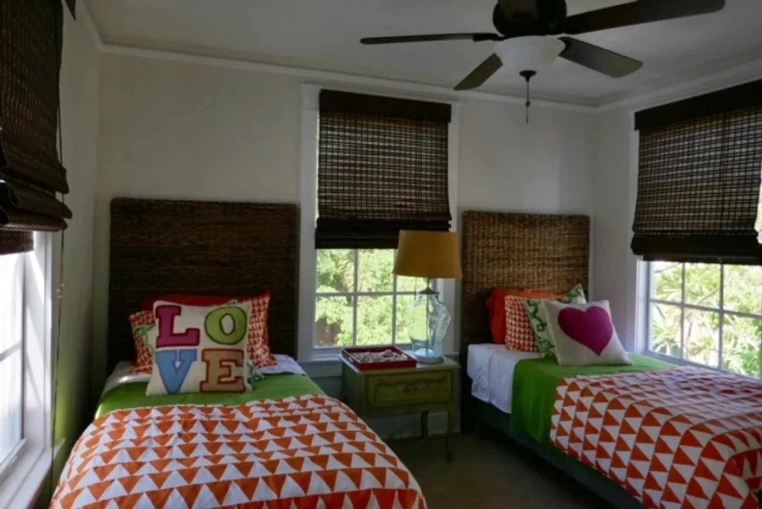 Twin bedroom after renovation with seagrass headboards